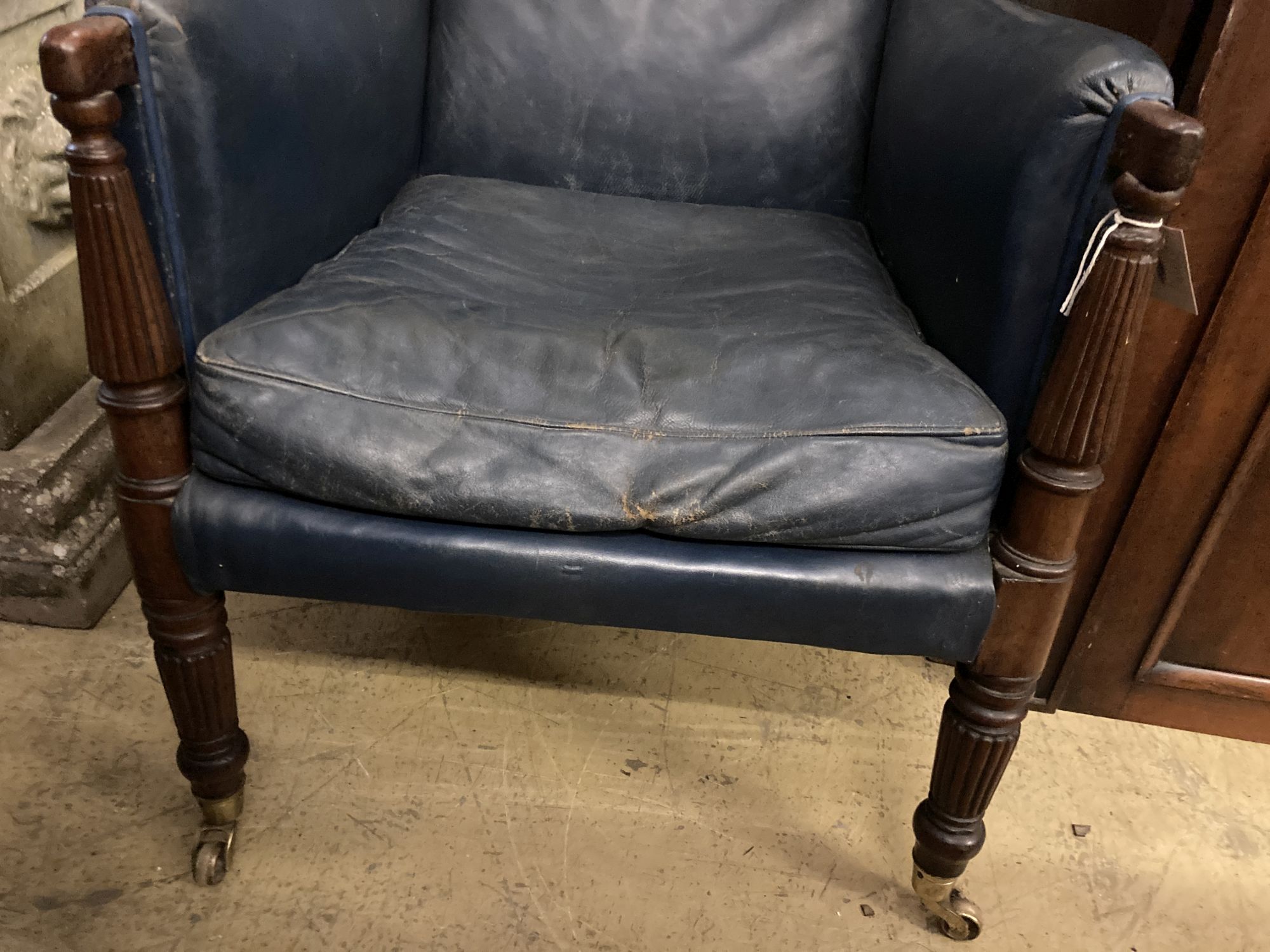 A Regency mahogany library chair, upholstered in blue leather, width 65cm depth 75cm height 93cm